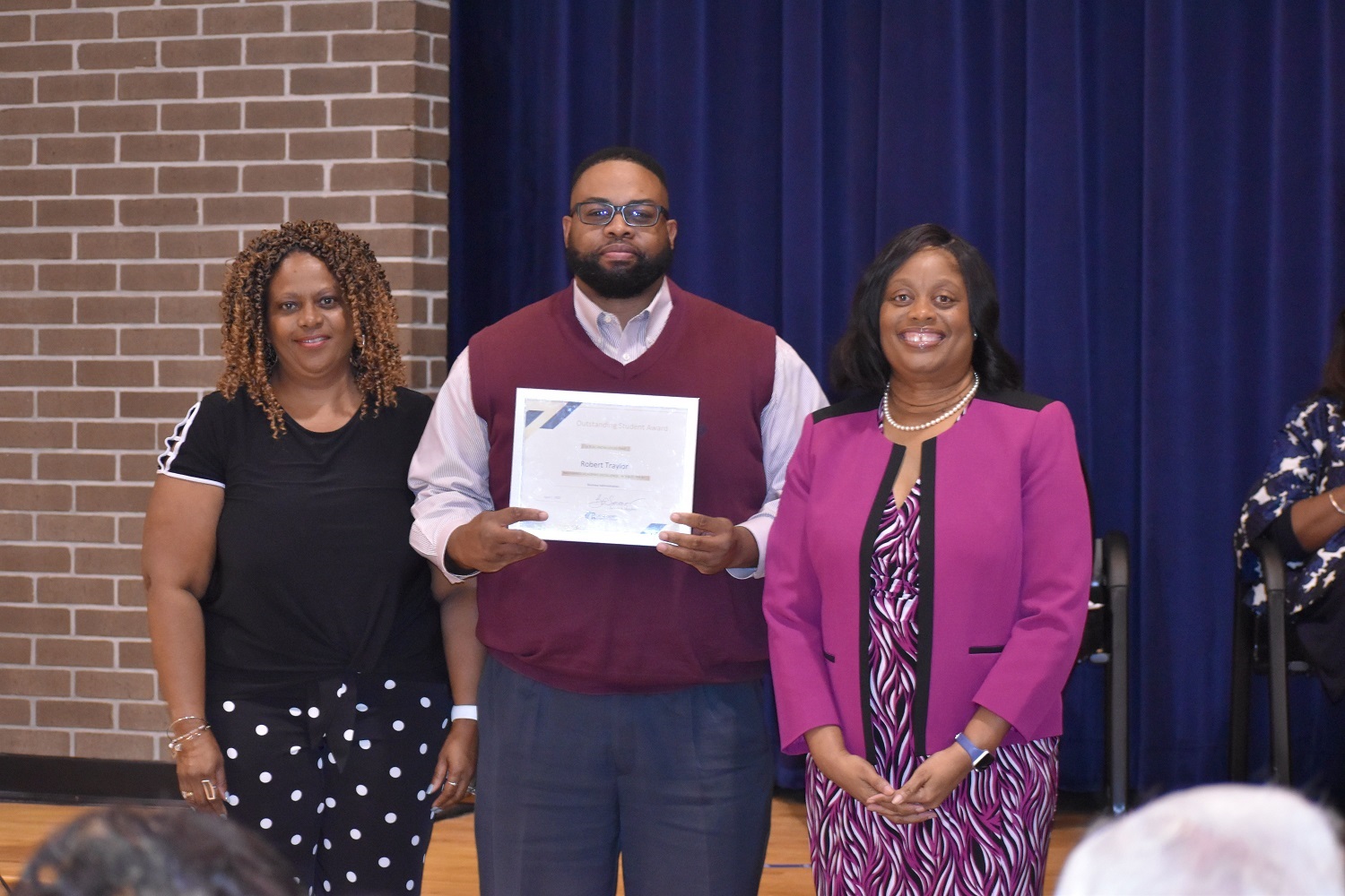 Robert Traylor was awarded the Business Administration Academic Excellence Highest GPA by Beverly Sessoms, Program Coordinator, Medical Office and Office Administration (left) and President Williams.